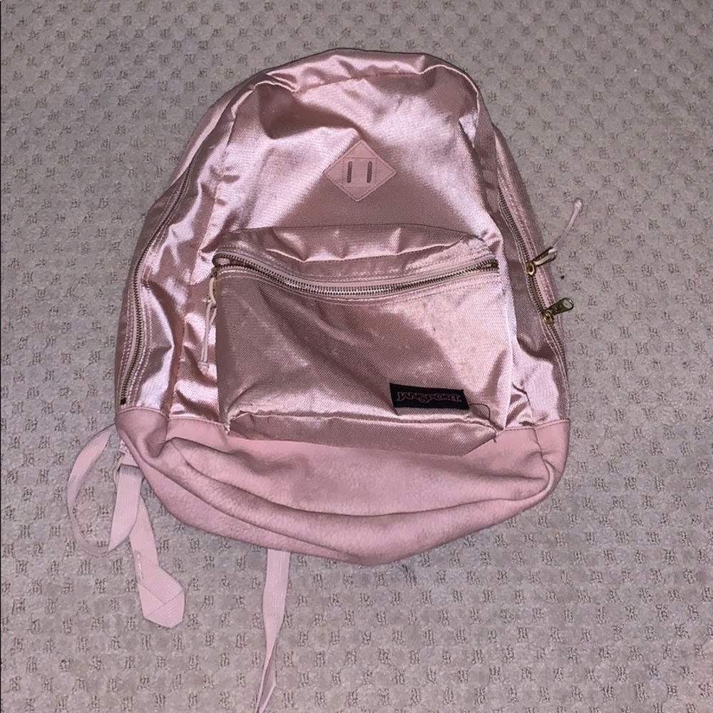 rose gold Jansport backpack